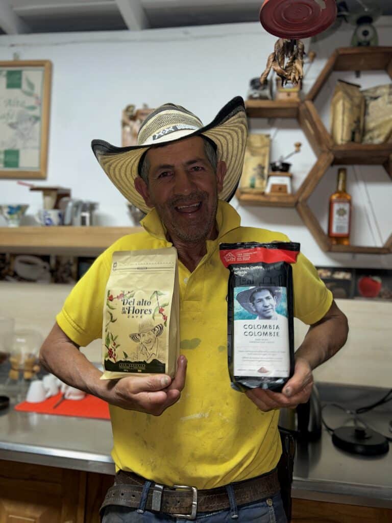 Local farmer proudly holding a bag of his freshly roasted coffee, with his illustrated portrait featured on the packaging, symbolizing five generations of family coffee tradition.