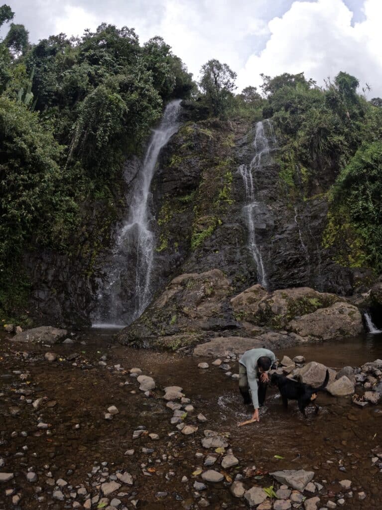 Final waterfall on the 7 Waterfalls Hike, with misty water flowing into a clear pool